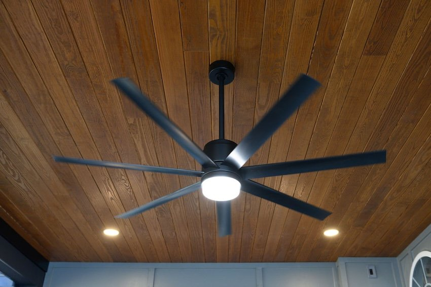  Clear pine ceiling stained Acorn Brown with recessed lighting and ceiling fan inside a screened porch in Columbia, MD.