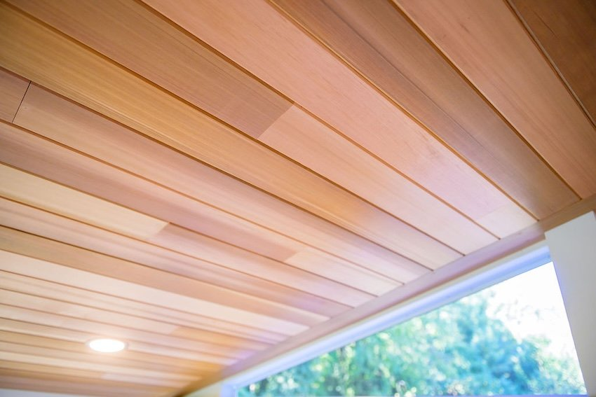 Premium cedar tongue and groove ceiling installed in screened porch