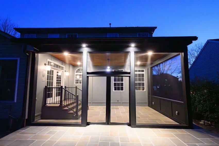  Screened porch illuminated at night showcasing modern outdoor living design in Columbia, Maryland.