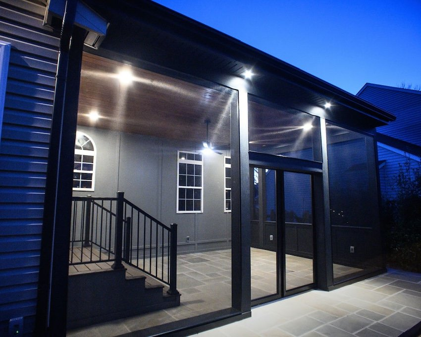  Luxury screened porch addition with large screened openings and architectural lighting in Columbia, Maryland.