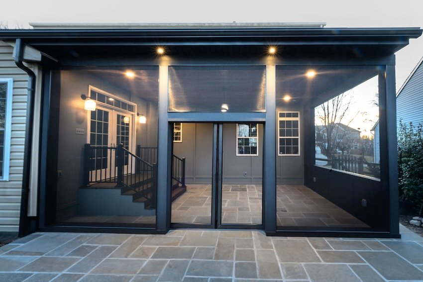  Front exterior view of a custom screened porch featuring dark structural accents and premium screening system in Columbia, MD.