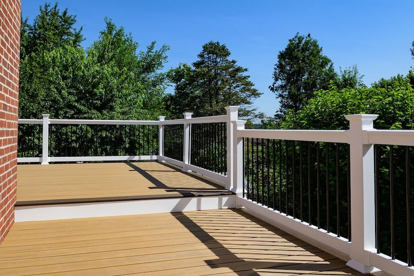 timbertech-deck-installation-catonsville-md - thefinalcuthomeimprovementllc.com Large TimberTech composite deck installation in Catonsville Maryland with white railing and black aluminum balusters