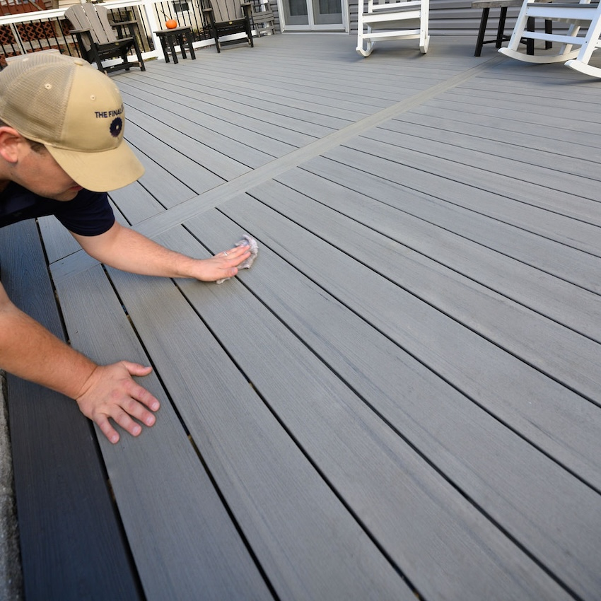 TimberTech Sea Salt Gray composite decking with Deckorators Dark Slate accents in a Columbia backyard.